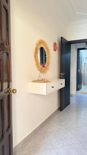 a room with a mirror on the wall with a counter at Firras Mdiq in M'diq