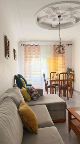 a living room with a couch and a table at Firras Mdiq in M'diq