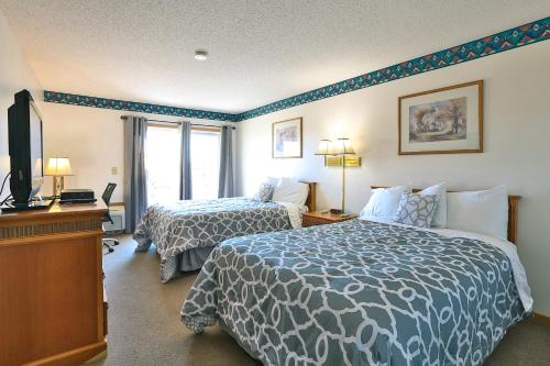 Postel nebo postele na pokoji v ubytování AmeriVu Inn & Suites New Richmond