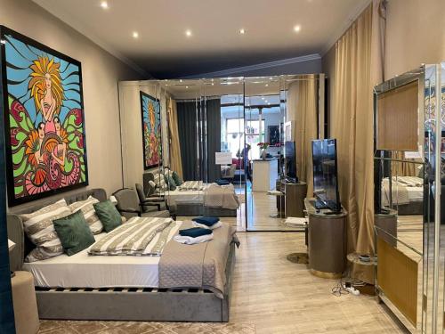a bedroom with a bed and a living room at Modern Suite in the Taunus in Bad Camberg