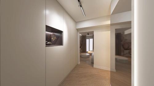 a hallway with a hallway leading to a bathroom at Tower Apartments in Cluj-Napoca