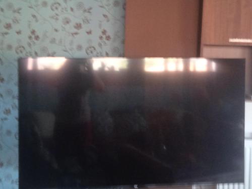 a view of a television screen in a kitchen at Lovely suite in Ierissos