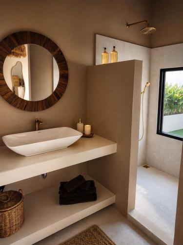 a bathroom with a large sink and a mirror at La Caza Sowana in Ko Phangan