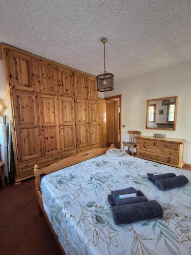 a bedroom with a large bed with two pillows on it at Il Posticino del Lago di Como in Esino Lario