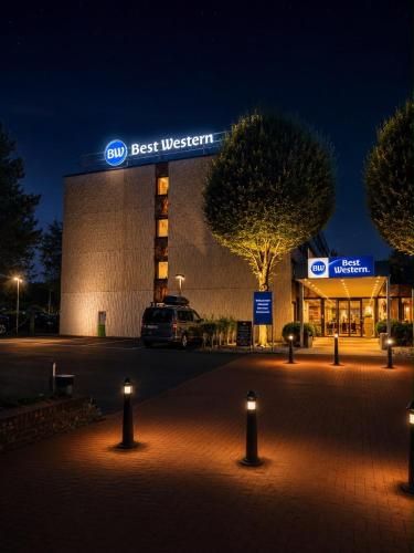 a best western building with lights in front of it at Best Western Hotel Bochum in Bochum