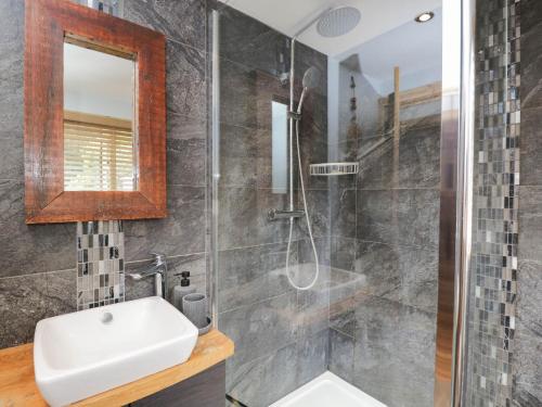 a bathroom with a sink and a shower at Little Orchard in Swallowcliffe