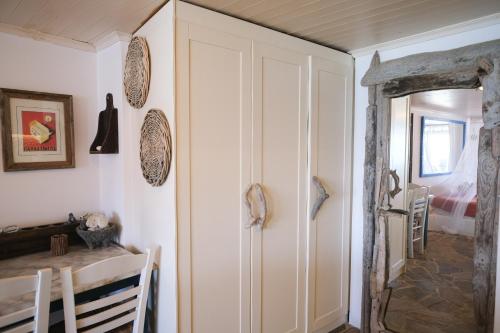 a dining room with a cabinet and a table at Paradiso in Firopótamos