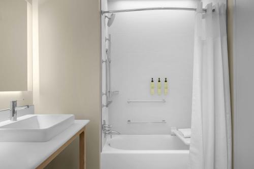 a white bathroom with a shower and a sink at Element by Marriott Boise Downtown in Boise