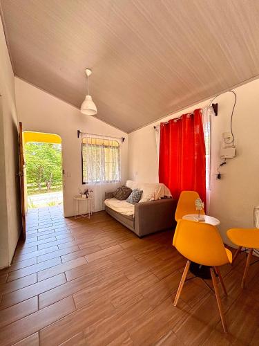 a living room with a bed and a table and chairs at Casa Malu in Morote