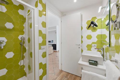 a bathroom with a sink and a shower at Sorrentina Guest House in Sorrento