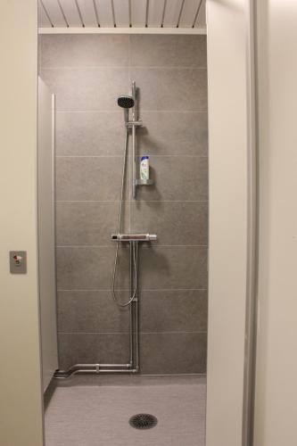 a shower stall in a bathroom with a shower at Ljusne Ice Camps in Ljusne