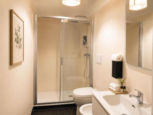 a bathroom with a shower and a toilet and a sink at Mars41 B&B in Bologna