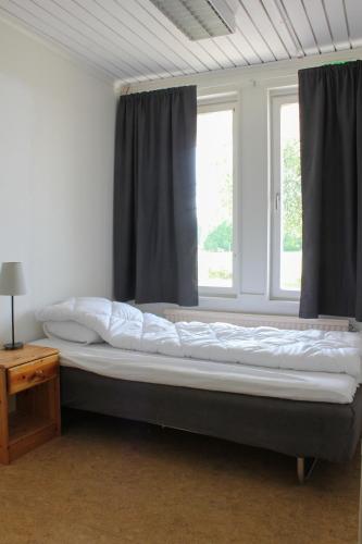 a large bed in a room with a window at Ljusne Ice Camps in Ljusne