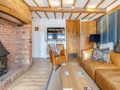 a living room with a couch and a table at Pen Y Groes in Welshpool