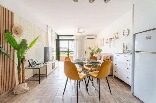 a kitchen and dining room with a table and chairs at Paz Ocean View, 2 Air Conditioners, Wifi, Heated pool in San Miguel de Abona