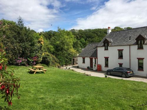 a picnic table in the yard of a cottage at Innish - Uk38783 in Clachan