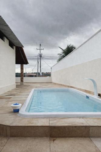 a large swimming pool sitting next to a building at Pousada do Delta in Tutóia