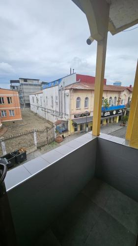 a view of a building from a balcony at Malta Hotel in Batumi