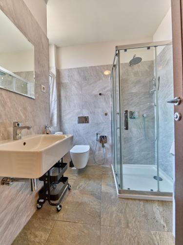 a bathroom with a sink and a shower at Teplice Apartments U Schodů in Teplice