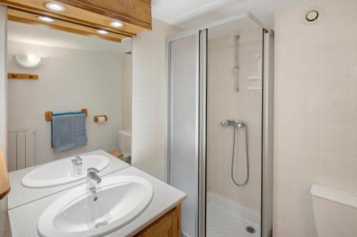 a bathroom with a sink and a shower at Chambres Et Table D'hôtes De Vernet in Saint-Germain-de-Calberte