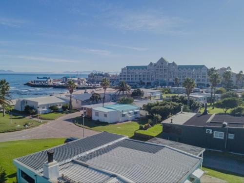 an aerial view of a resort and the ocean at Palmview Cottage in Cape Town