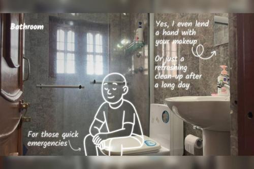 a bathroom with a drawing of a man sitting on a toilet at Gokarna Homestay in Kathmandu