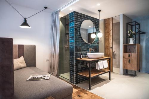 a bathroom with a sink and a mirror at CORE Kaprun in Kaprun