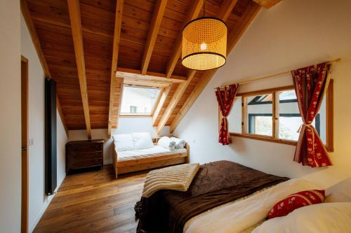 a bedroom with a large bed in a room at Le val'heureux in Valloire