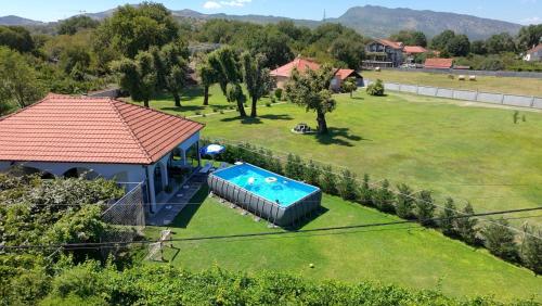 an aerial view of a house with a swimming pool at Hidden Oasis PeSa - Luxury Villa with Pool & Spa in Podgorica