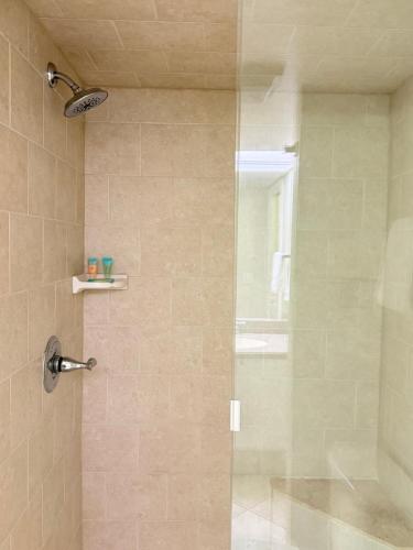 a shower with a glass door in a bathroom at Lifetime of Vacations in Orlando
