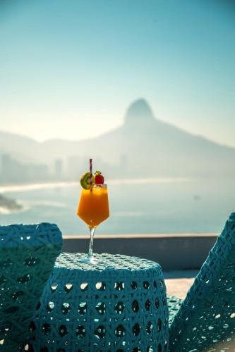 a drink sitting on top of a table at La Suite by Dussol in Rio de Janeiro