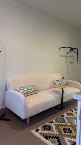 a living room with a couch and a table at Molfar green 