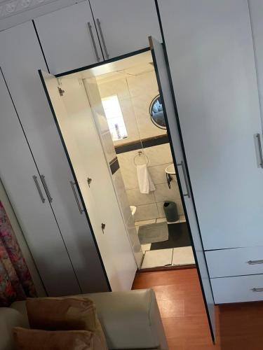 a view of a bathroom with a sliding glass door at Executive B & B in Beacon Bay