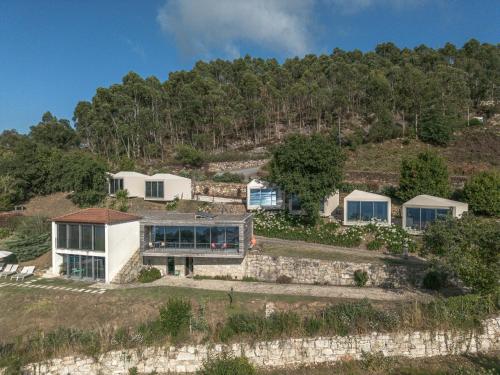 an aerial view of a house on a hill at aMaRe Country House in Caminha