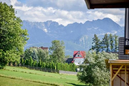 a view of a mountain range from a house at Domek u Hanci Pod Gubałówką z Jacuzzi in Ząb