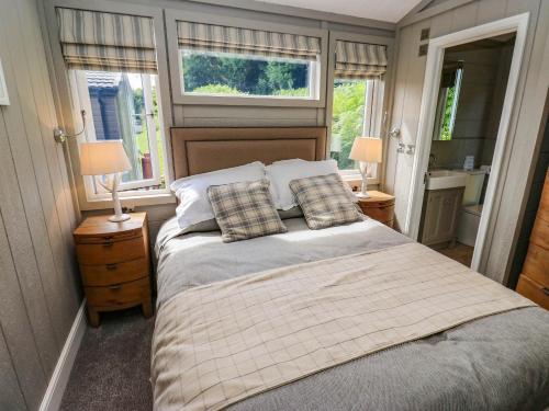 a bedroom with a bed with two pillows on it at Dales Retreat in Skipton