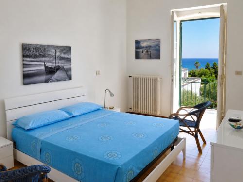 a bedroom with a bed and a view of the ocean at Villa Stasi B&B in Leuca