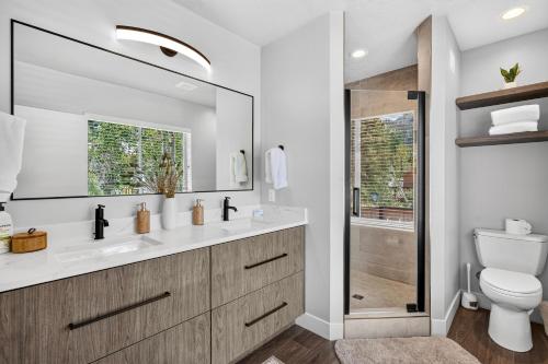 a bathroom with a toilet and a sink and a shower at Manor at Brighton in Brighton