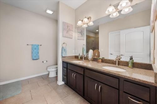 a bathroom with a sink and a toilet at Lakefront Paradise with Stunning Views! in Corsicana