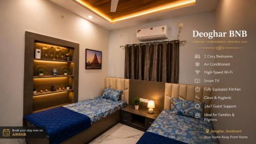 a small room with two beds and a window at Deoghar BnB in Deoghar