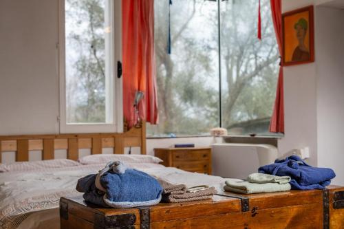 a bedroom with a bed with towels and a window at Granducato di Monteballante in Pesaro