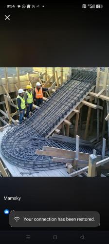 two construction workers are working on a train track at Sky Beach Resort Ltd in Kisumu