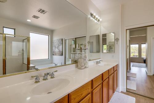 a bathroom with two sinks and a large mirror at Fire Pit & Large Yard! Luxury Anthem Escape in Anthem