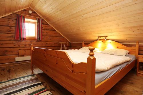 מיטה או מיטות בחדר ב-Kjøsnes Feriehytter