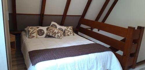 a small bed with pillows on it in a room at Gite Pinot Blanc n°3 à Kaysersberg in Kaysersberg