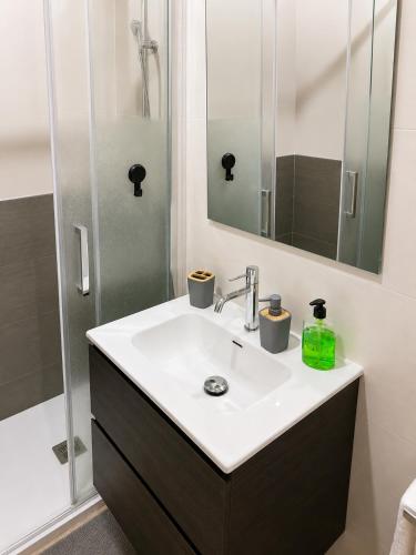 a bathroom with a sink and a mirror at Condado de Alhama - Suchan living in El Romero