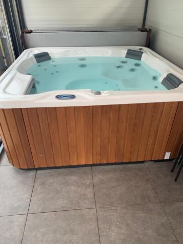 a jacuzzi tub sitting in a room at Filkes Rezidence in Filkeháza