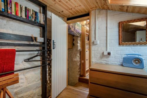 a tiny house with a kitchen and a refrigerator at 3 Bed in Eype oc-e34183 in West Bay
