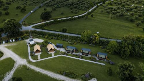 an aerial view of a house in a field at simami resort in Caldarola