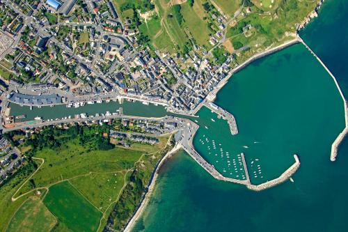 an aerial view of a city and the water at Fenêtre sur Mer I CAP MER in Port-en-Bessin-Huppain